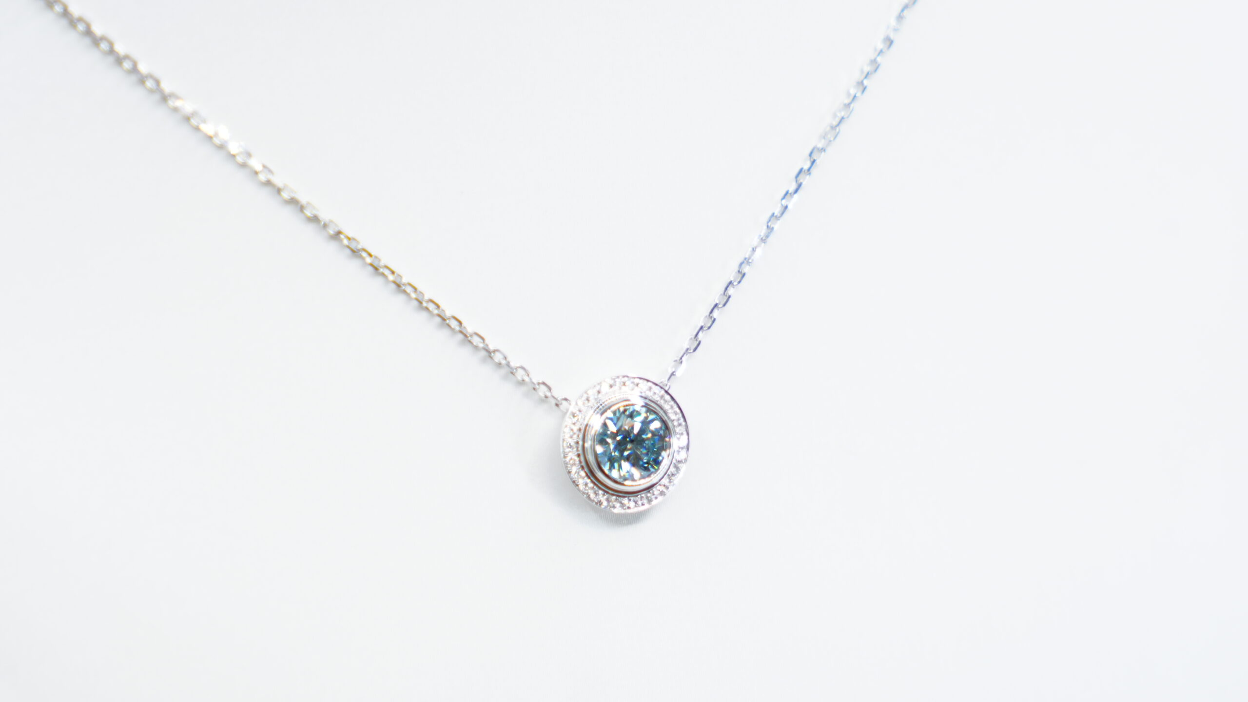 1.00 carat tw round laboratory grown blue diamond halo pendant necklace in 9kt white gold 1.00 carat tw round laboratory grown blue diamond halo pendant necklace in 9kt white gold