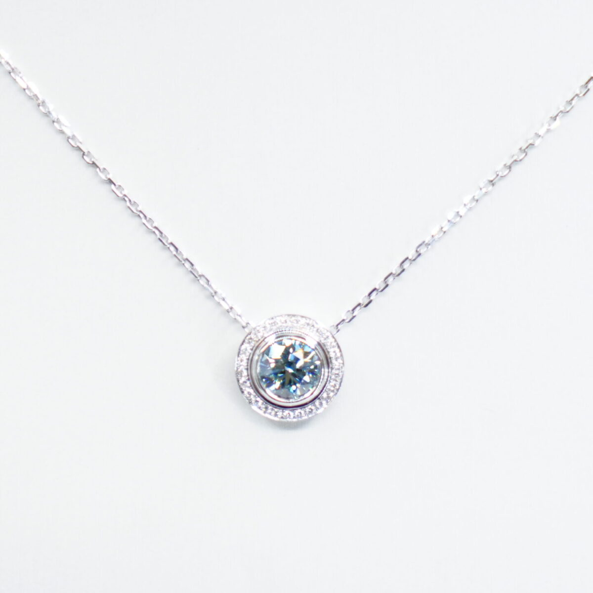 1.00 carat tw round laboratory grown blue diamond halo pendant necklace in 9kt white gold