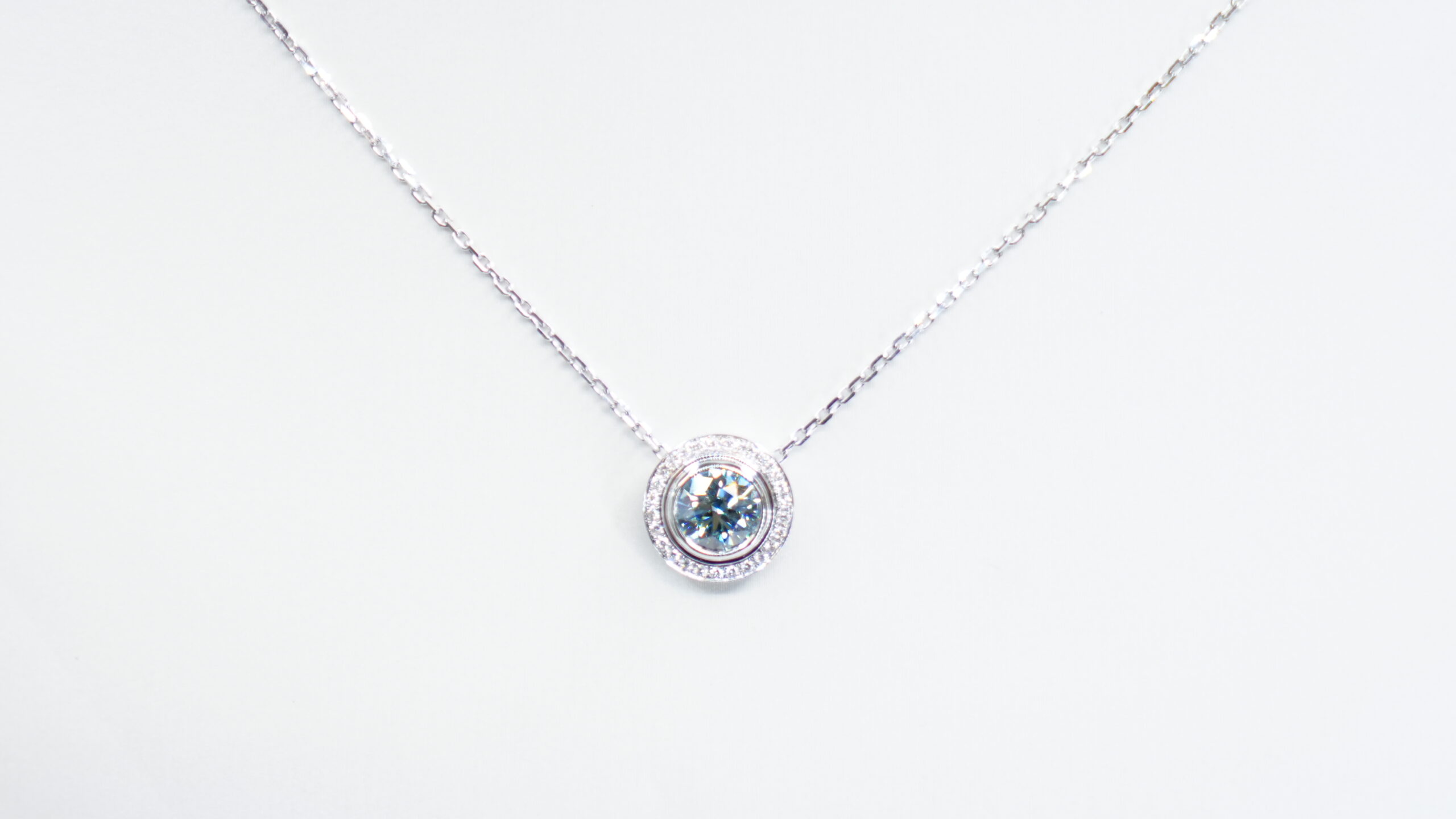 1.00 carat tw round laboratory grown blue diamond halo pendant necklace in 9kt white gold