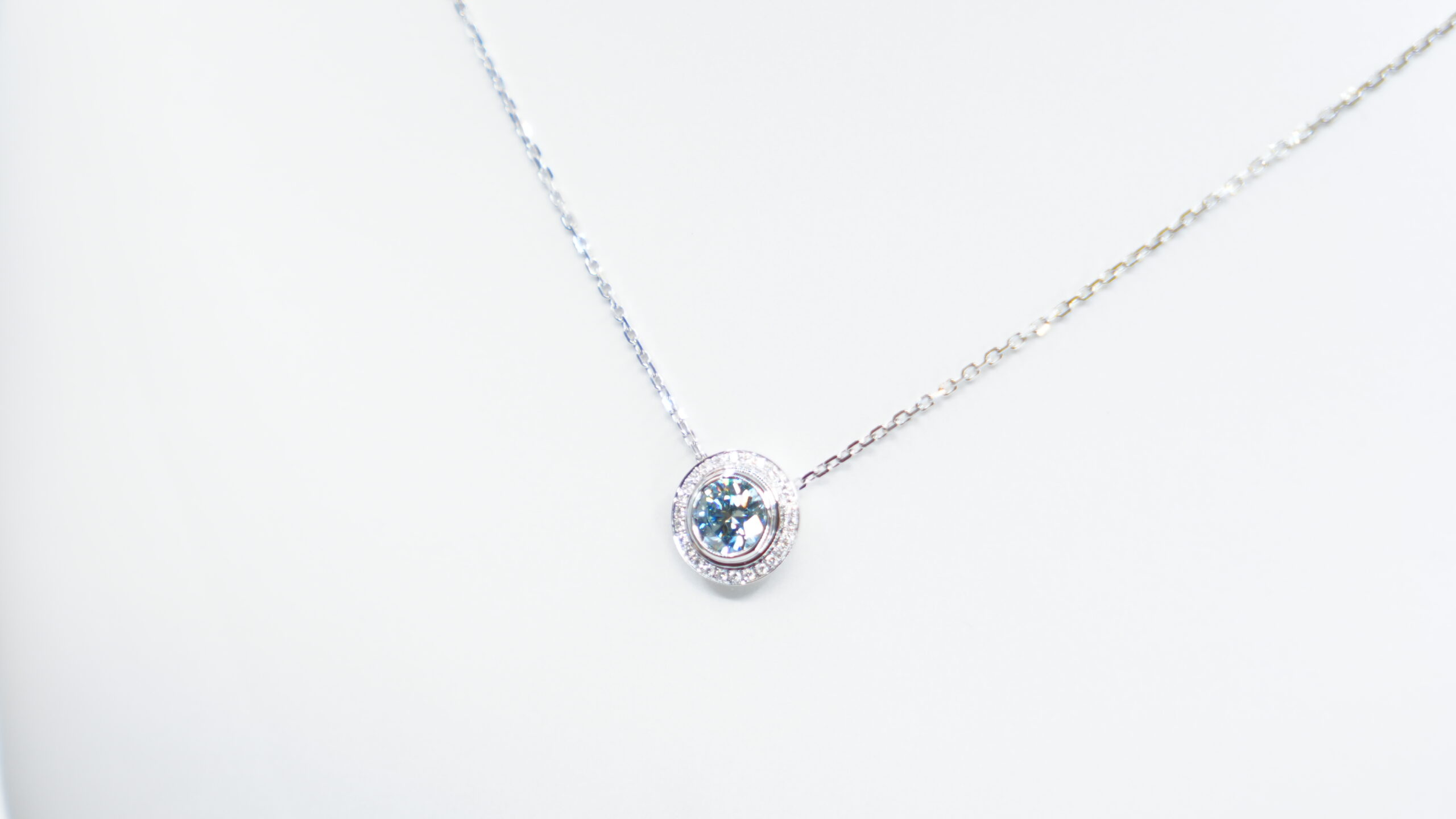 1.00 carat tw round laboratory grown blue diamond halo pendant necklace in 9kt white gold 1.00 carat tw round laboratory grown blue diamond halo pendant necklace in 9kt white gold