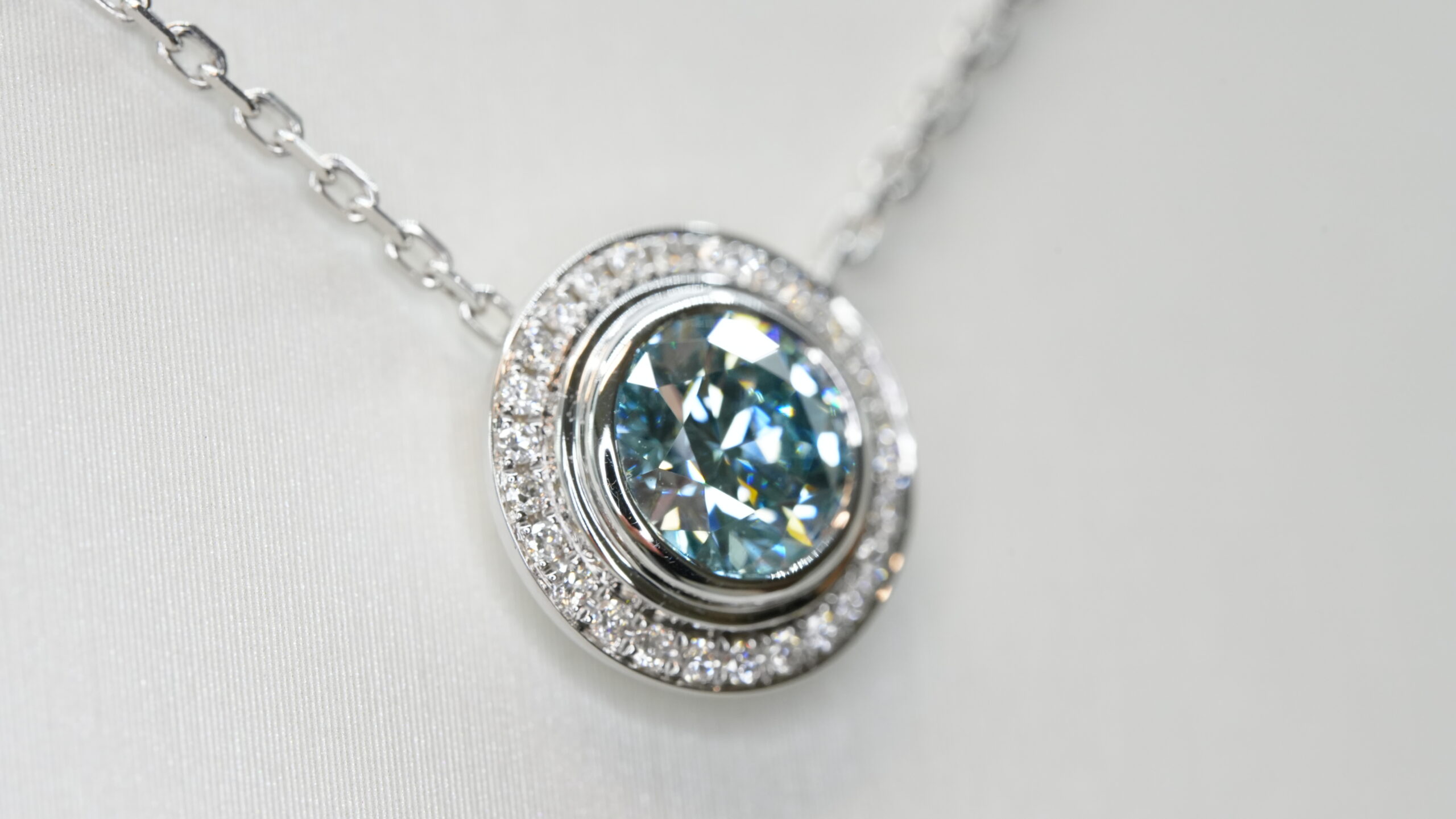 Round laboratory grown blue diamond halo pendant necklace Round laboratory grown blue diamond halo pendant necklace