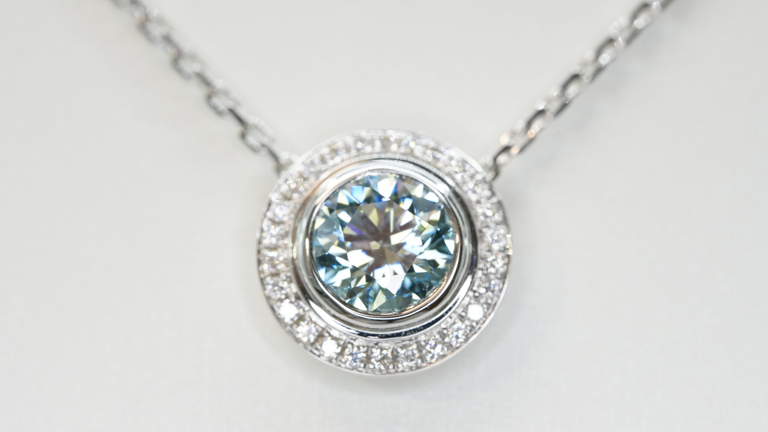 Round laboratory grown blue diamond halo pendant necklace Round laboratory grown blue diamond halo pendant necklace