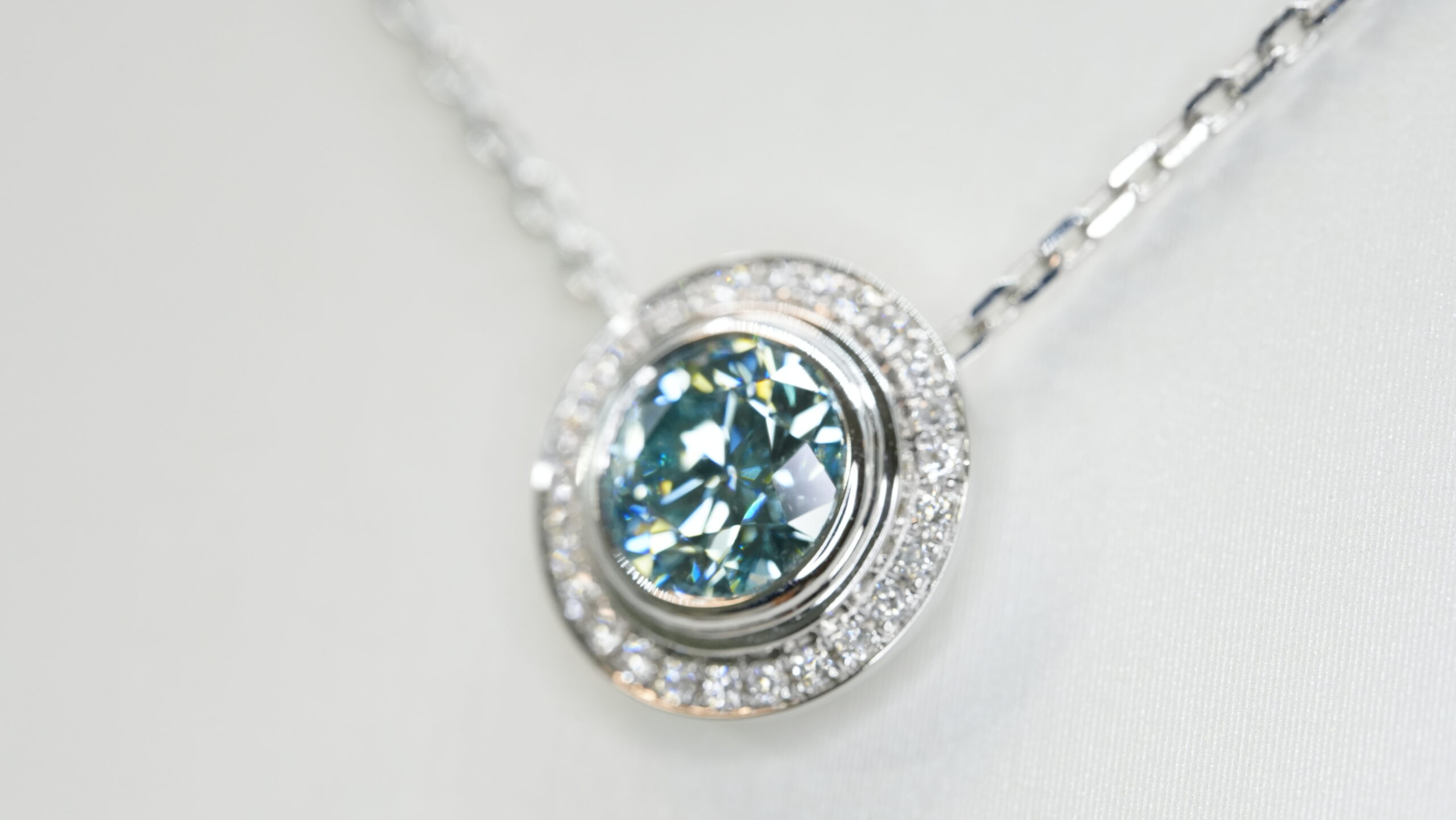 Round laboratory grown blue diamond halo pendant necklace Round laboratory grown blue diamond halo pendant necklace