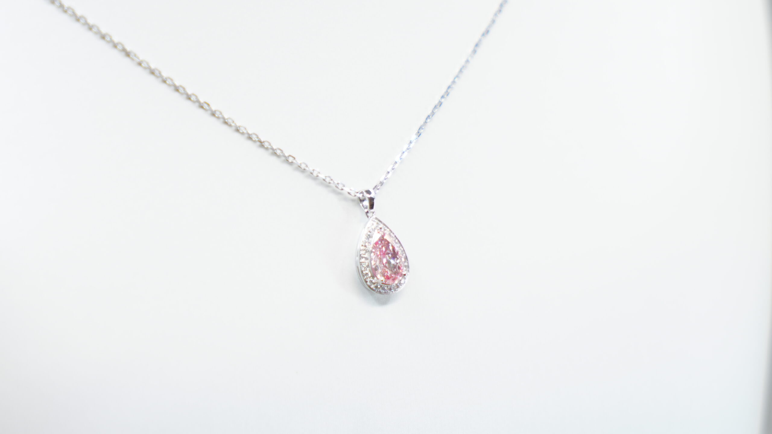 1.116 carat tw pear laboratory grown pink diamond halo pendant necklace in 9kt white gold 1.116 carat tw pear laboratory grown pink diamond halo pendant necklace in 9kt white gold