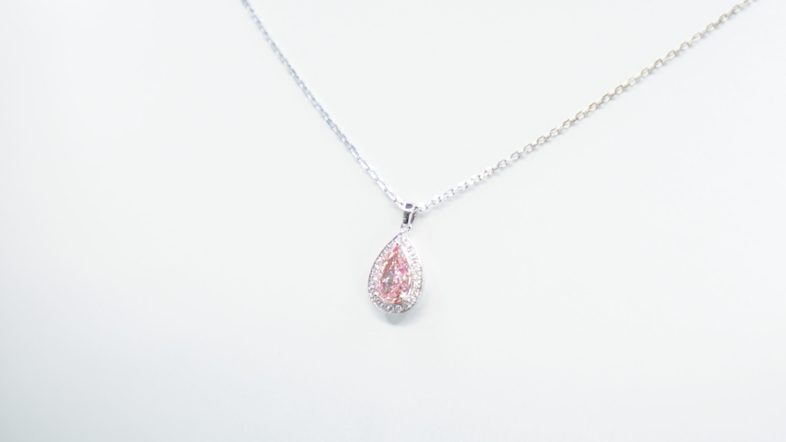 1.116 carat tw pear laboratory grown pink diamond halo pendant necklace in 9kt white gold 1.116 carat tw pear laboratory grown pink diamond halo pendant necklace in 9kt white gold
