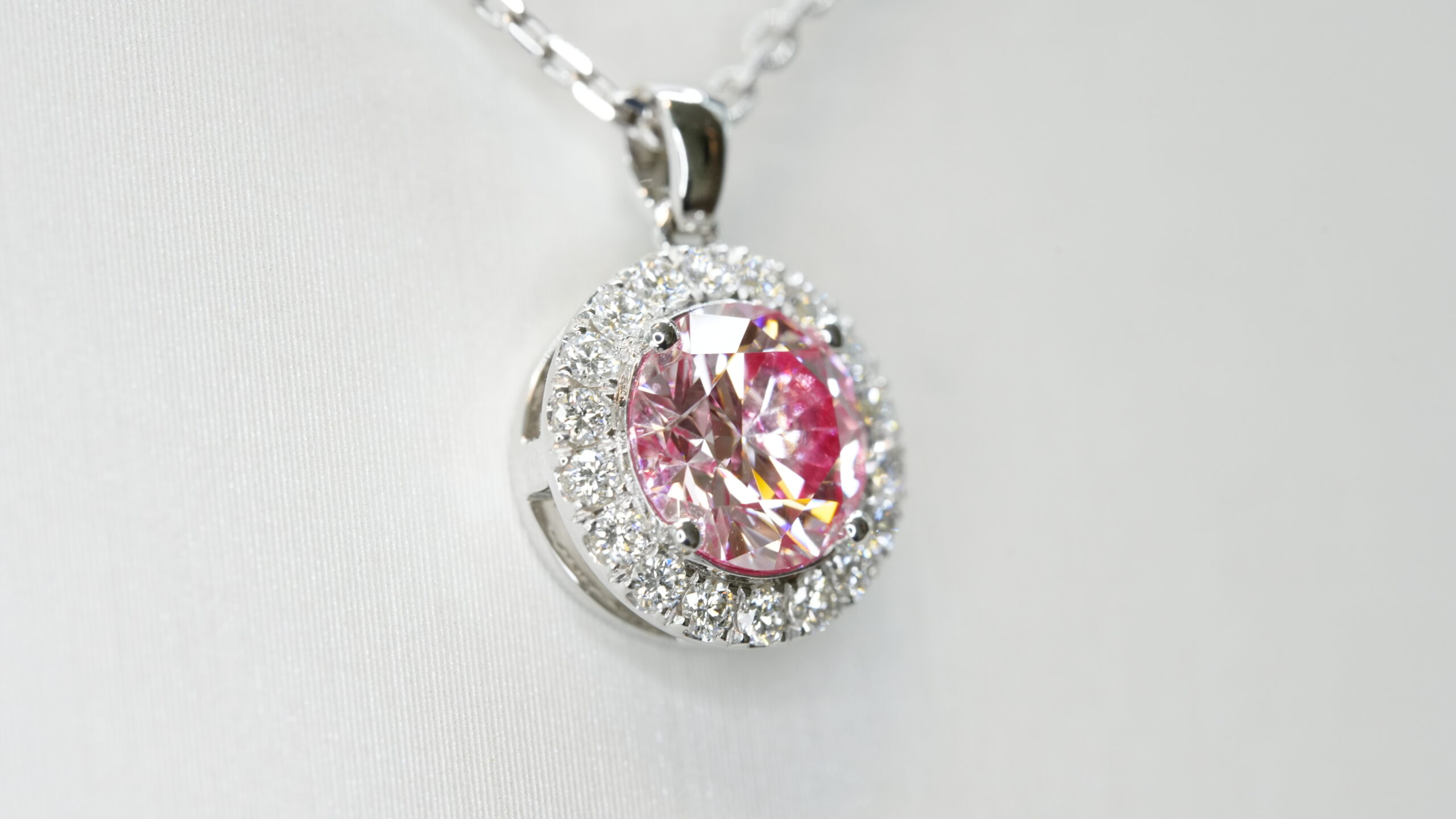 Round laboratory grown pink diamond halo pendant necklace Round laboratory grown pink diamond halo pendant necklace