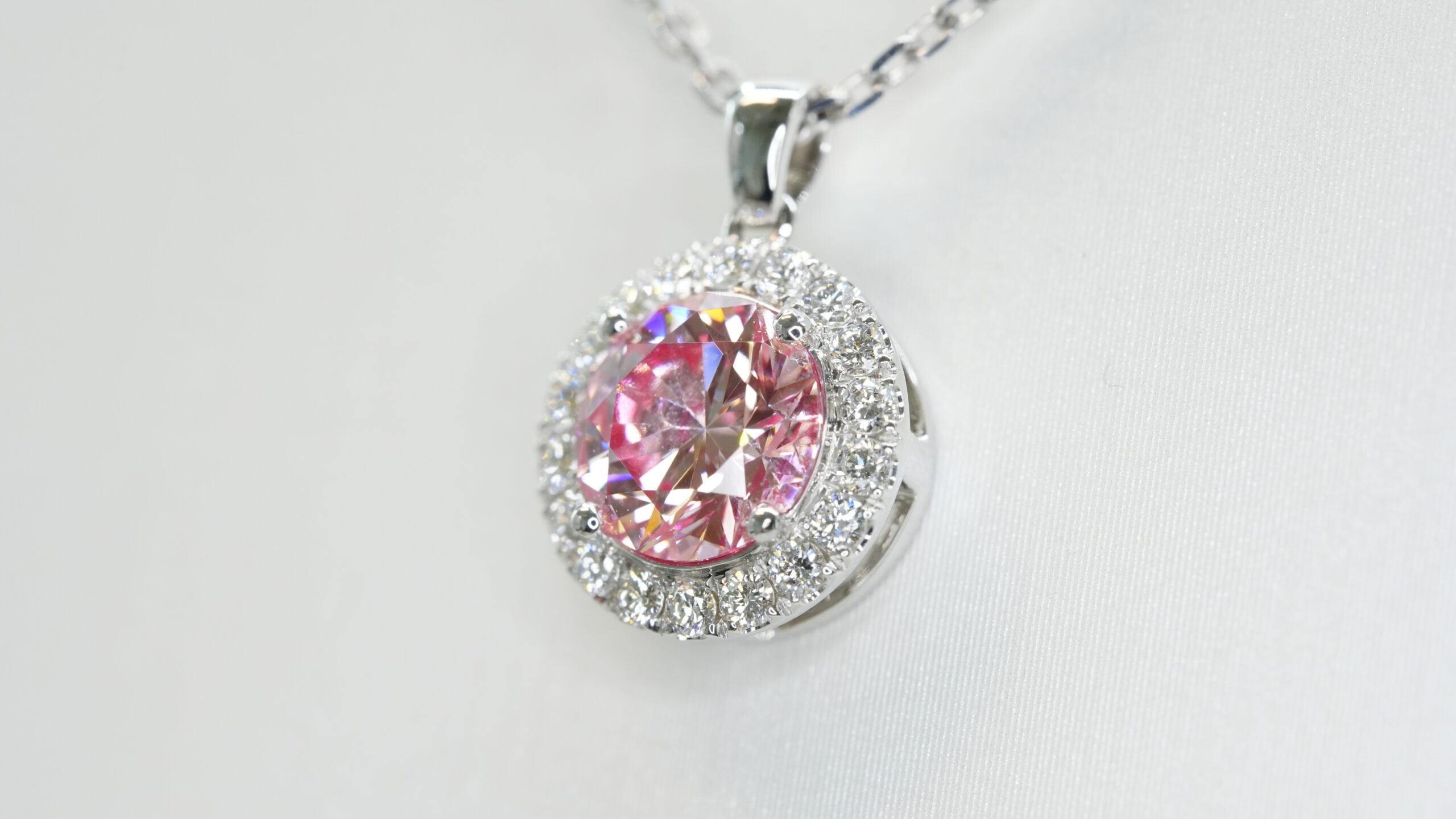 Round laboratory grown pink diamond halo pendant necklace Round laboratory grown pink diamond halo pendant necklace